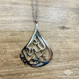 Mashallah car hanging with Arabic calligraphy in teardrop design, metal polished finish, perfect for Islamic decor and inspiration on the road.